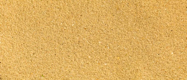 Panorama of Sand texture. Sandy beach for background. Top view. Natural sand stone texture background. sand on the beach as background. Wavy sand background for summer designs