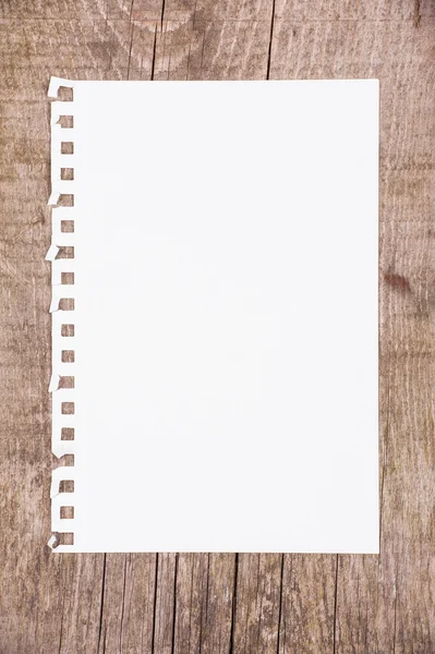 Sheet of paper on wooden background — Stock Photo, Image