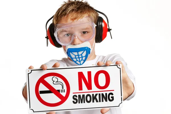 Boy with protection and no smoking sign — Stock Photo, Image