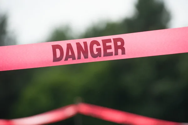 Danger Boundary Tape in a Field. — Stock Photo, Image