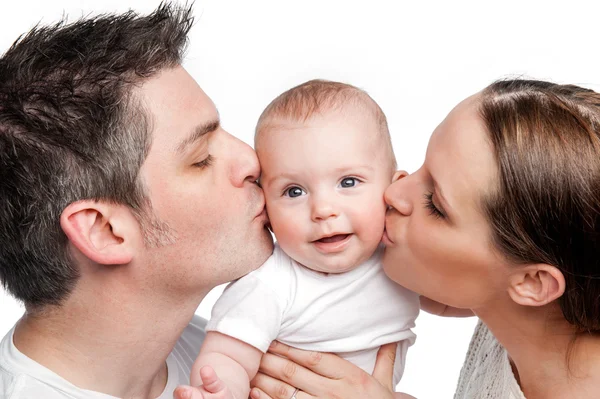 Батьки цілуються Щаслива дитина Стокове Фото
