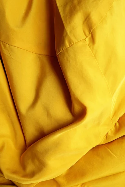 top view yellow clothes fabric texture background