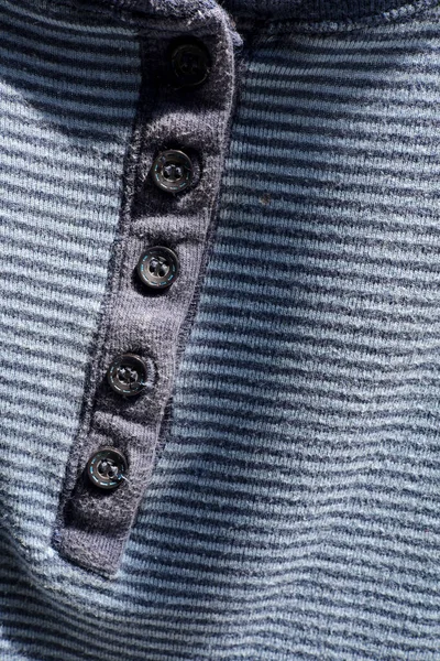 close-up fabric texture of a blue dress