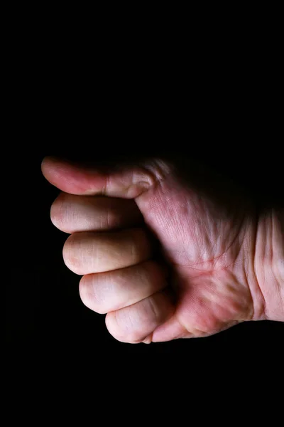 hand of a person on a black background