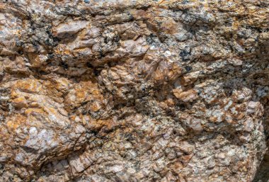 Bir çok boyut, şekil, doku, çizgiler, çıkıntılar ve renkler ile, bu ekstrem insanlar Colorado dağının büyük bir kaya parçasına çok yakınlar..