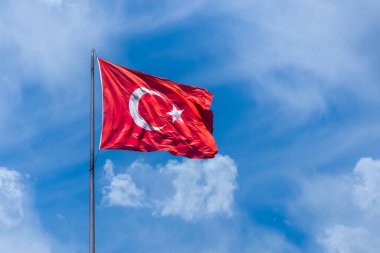 The Turkish flag is the national and official flag of the Republic of Turkey. It consists of a white crescent moon and star on a red background. It was accepted in the Republic period.