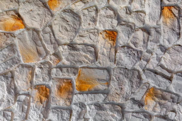 The texture of the stone wall. Background texture of the stone wall of the old building. Stone wall as background or texture