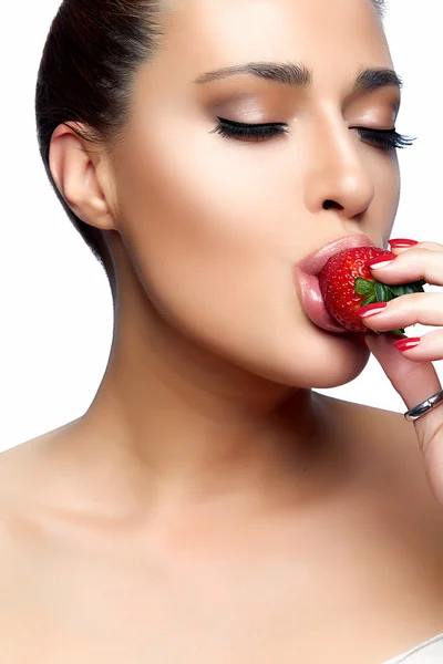 Beautiful Young Woman Eating Strawberry Stock Image