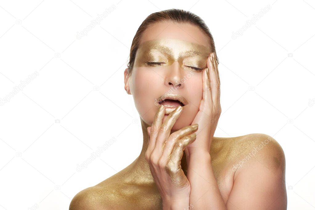 Gold beauty makeup and nail art concept. Beauty with gold Cosmetics. High beauty portrait isolated on white