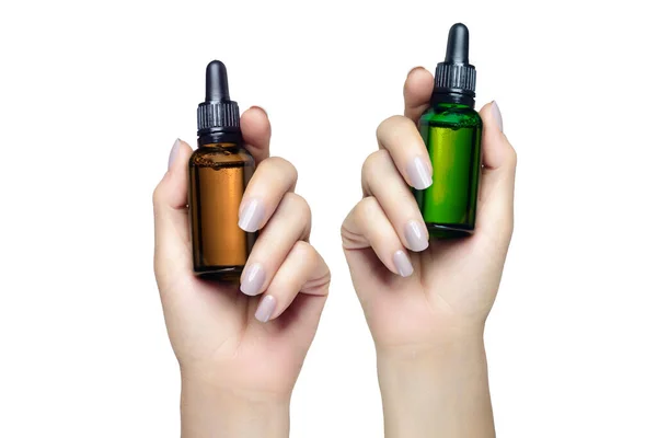 Dos Manos Femeninas Sosteniendo Botellas Gotero Sin Etiqueta Cosmetología Belleza —  Fotos de Stock