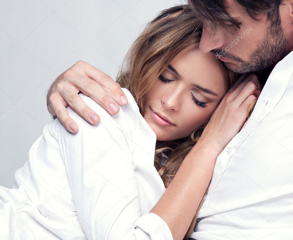 Portrait of romantic couple touching and kissing each other