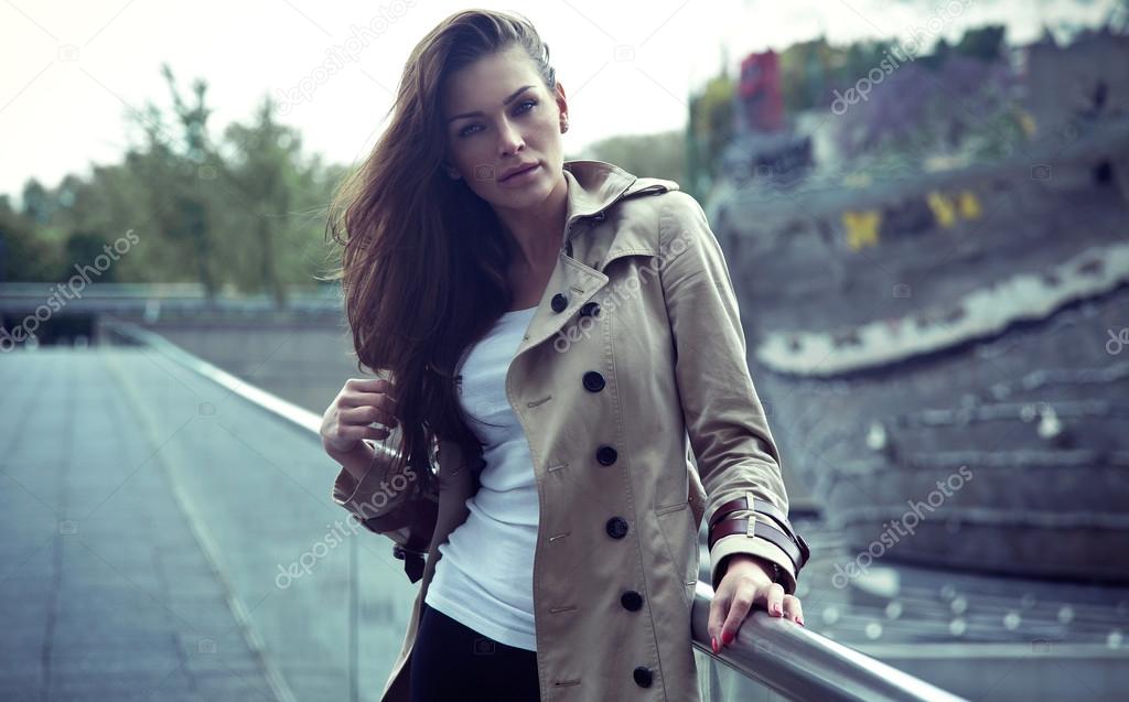 Beautiful young woman wearing coat