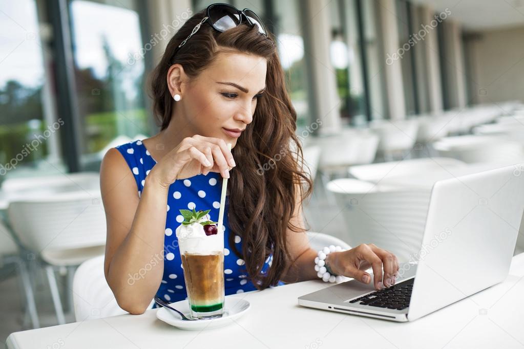 Beautiful business woman browsing the internet