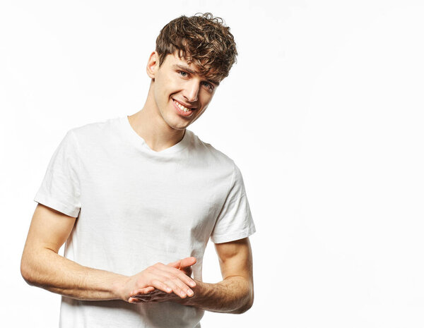 Portrait of handsome smiling man in white t-shirt isolated on white background  