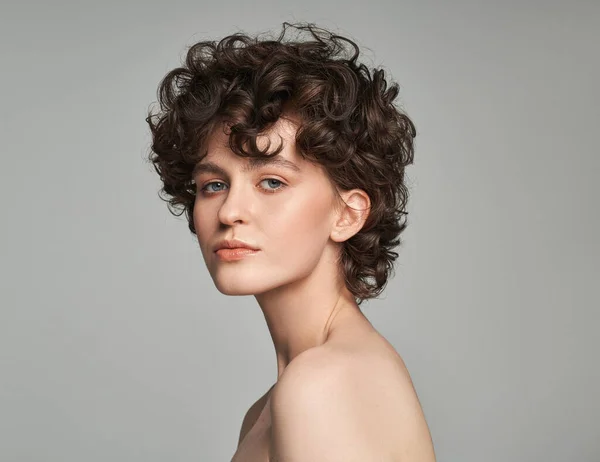 Portrait Brunette Woman Curls Isolated Gray Background — стоковое фото