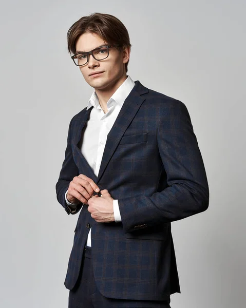 Portrait Young Man Buttoning His Jacket Gray Background — 스톡 사진
