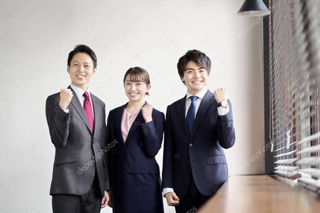 Asian business person doing guts pose