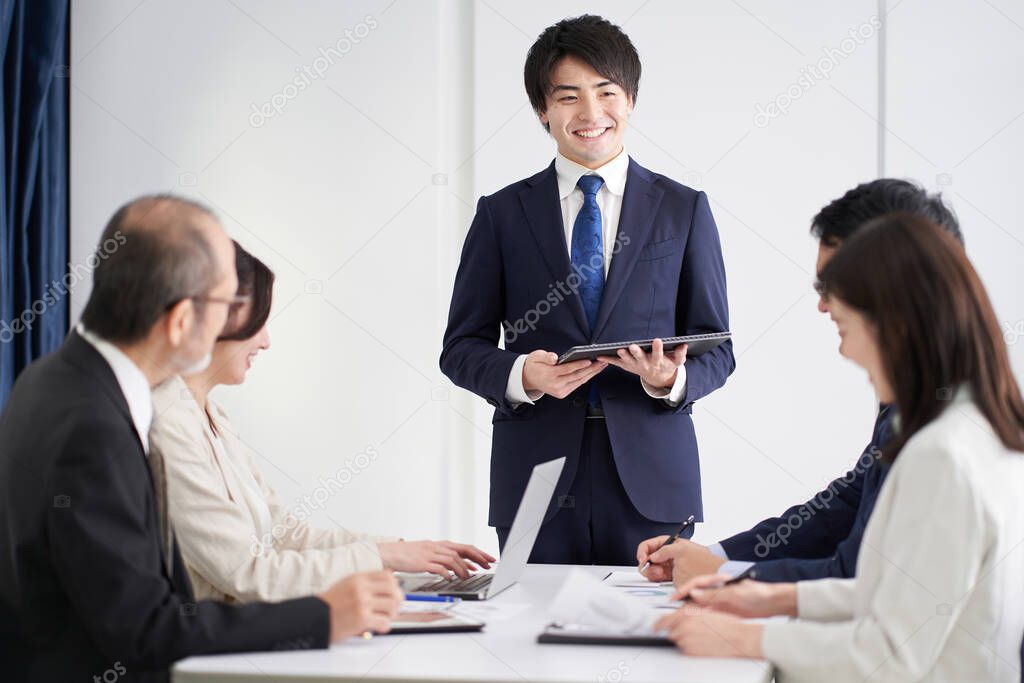 Asian businessman explaining at a meeting