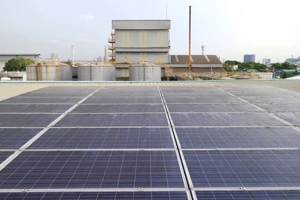 Dirty Unclean Solar Panels on Industrial Roof. The Lack of cleaning will reduce the efficiency of the electricity generation.