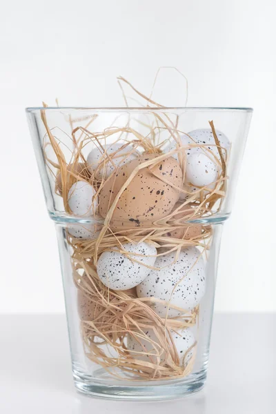 Easter eggs in glass vase — Stock Photo, Image