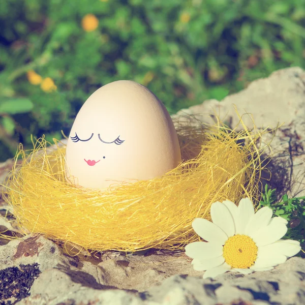 Retro style Easter egg with female face drawn on it — Stock Photo, Image