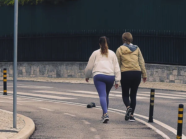 People maintaining their physical condition on a winter's day