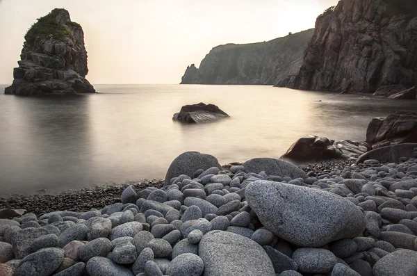 Horizontal landscape of rocky coast with pebbles