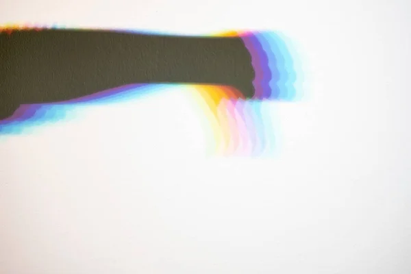 Regenbogenschatten Einer Hand Mit Gesenktem Daumen Auf Weißem Hintergrund Negative — Stockfoto