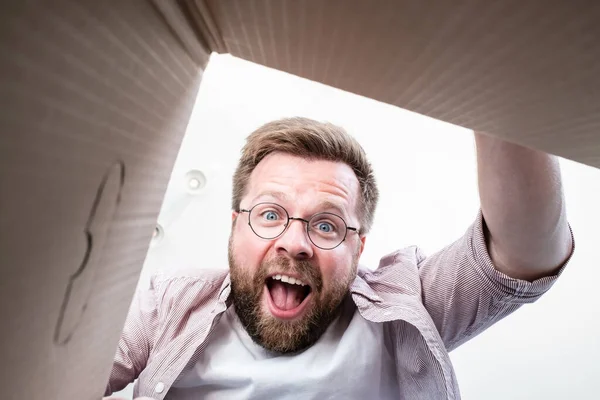 Man Glasses Unpacked Delivered Box Parcel Looks Contents Shouts Joy — Stock Photo, Image