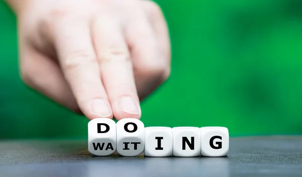 Hand Turns Dice Changes Word Waiting Doing — Stock Photo, Image