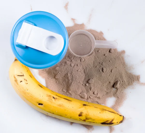Shaker, protein powder and banana — Stock Photo, Image