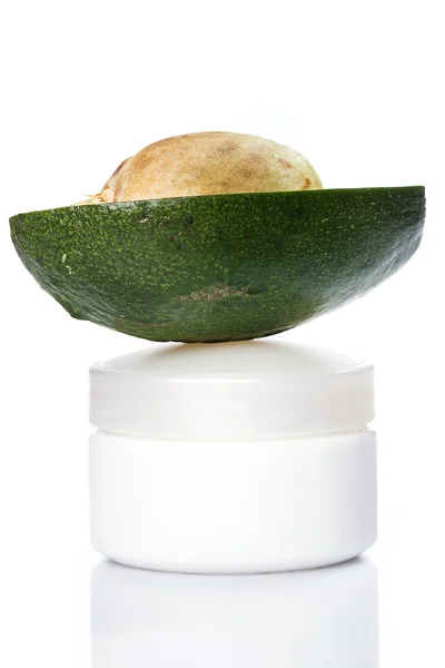 Avocado and moisturizer cream — Stock Photo, Image