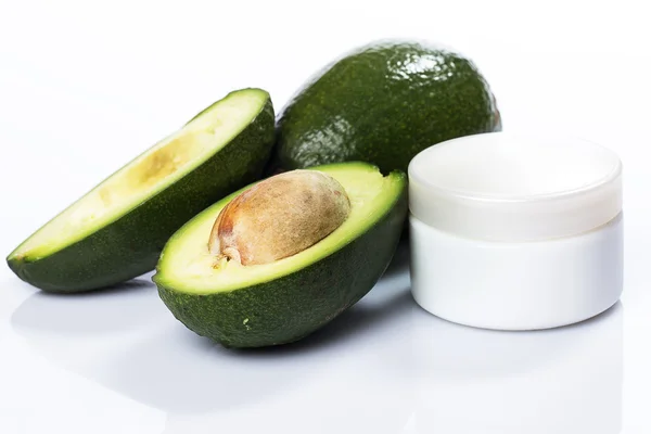 Avocado and moisturizer cream — Stock Photo, Image