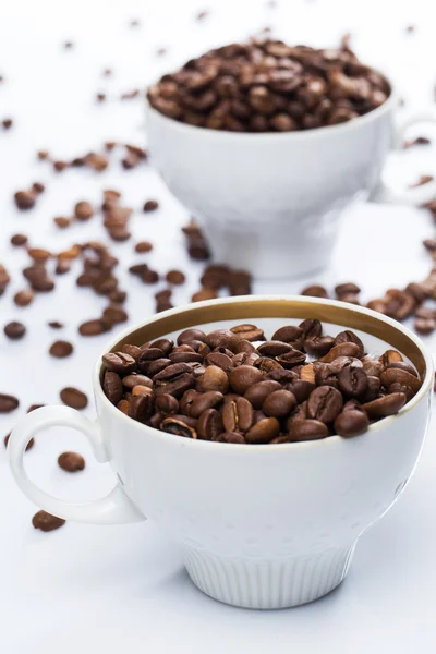 Coffee beans and cups — Stock Photo, Image