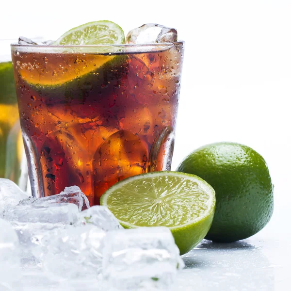 Fresh cocktail with cola drink and lime — Stock Photo, Image