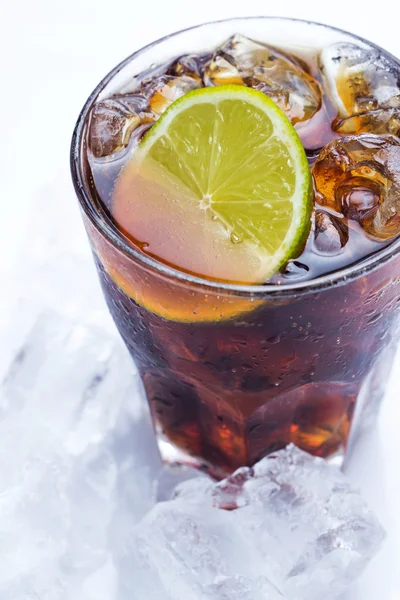 Fresh cocktail with cola drink and lime — Stock Photo, Image