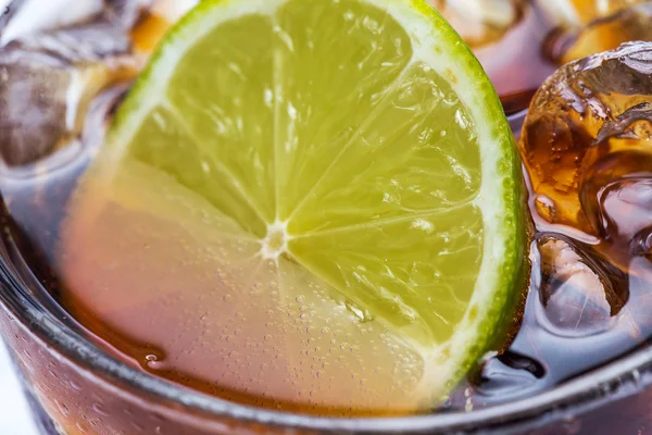 Fresh cocktail with cola drink and lime — Stock Photo, Image