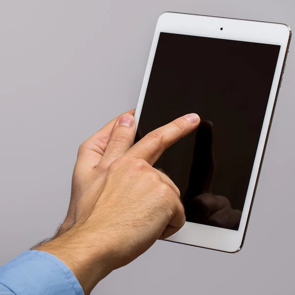 White tablet pc in hands — Stock Photo, Image