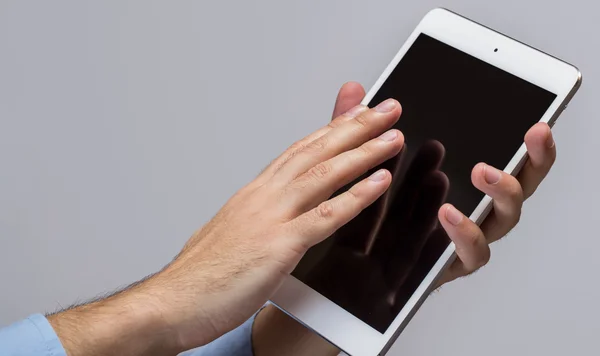 White tablet pc in hands — Stock Photo, Image