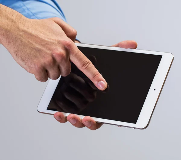 White tablet pc in hands — Stock Photo, Image