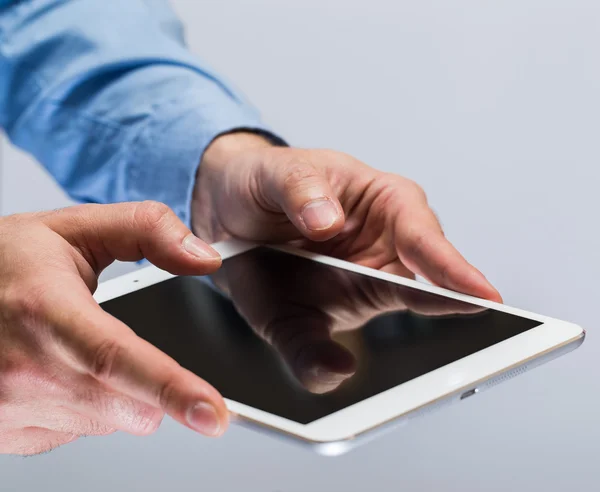 White tablet pc in hands — Stock Photo, Image