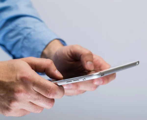 White tablet pc in hands — Stock Photo, Image