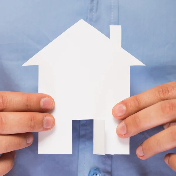 Man holding paper house in his hands — Stock Photo, Image