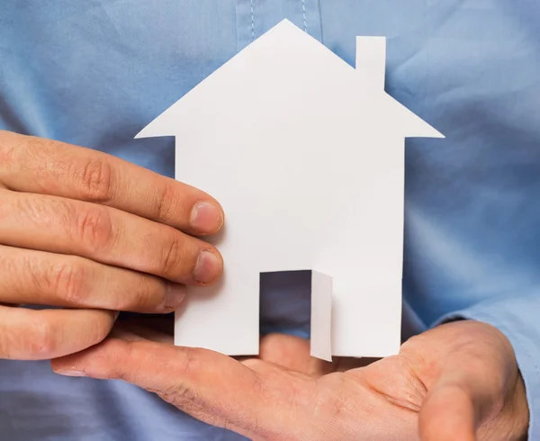 Man holding paper house in his hands — Stock Photo, Image