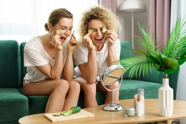 Two Beautiful Cheerful Girls Applying Cucumber Slices Eye Skin Home — Stock Photo, Image