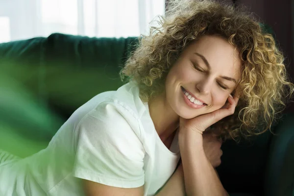 Portrait Young Beautiful Woman Curly Hair Lying Green Sofa — Stock Photo, Image
