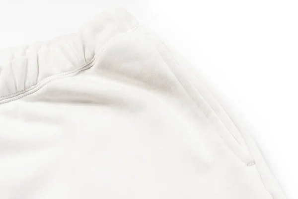 白いスウェットパンツのコットン生地の質感のクローズアップ — ストック写真