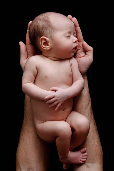 Cute Newborn Baby Lying Father Hands Black Background — Stock Photo, Image