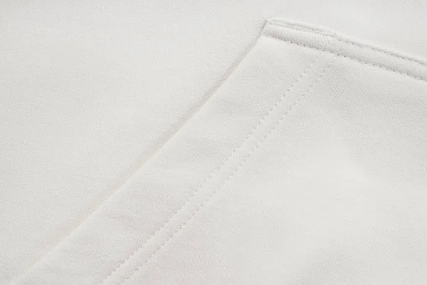 白い服のコットンスウェットシャツ生地の質感のクローズアップ — ストック写真
