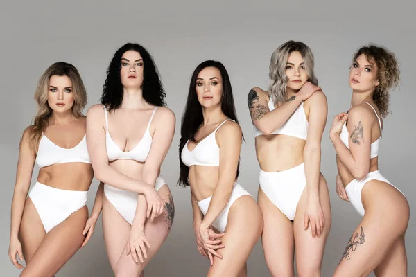 Group Different Beautiful Women Wearing White Lingerie Gray Background — Stock Photo, Image